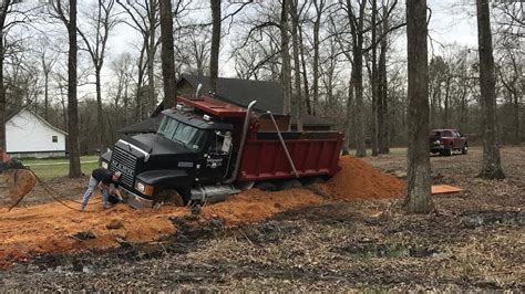 stuck excavator trackhoe buried